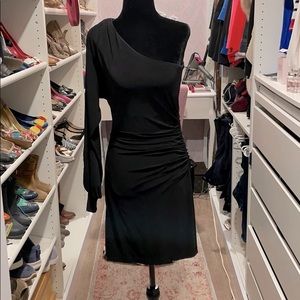 Black, knee length, one shoulder cocktail dress.